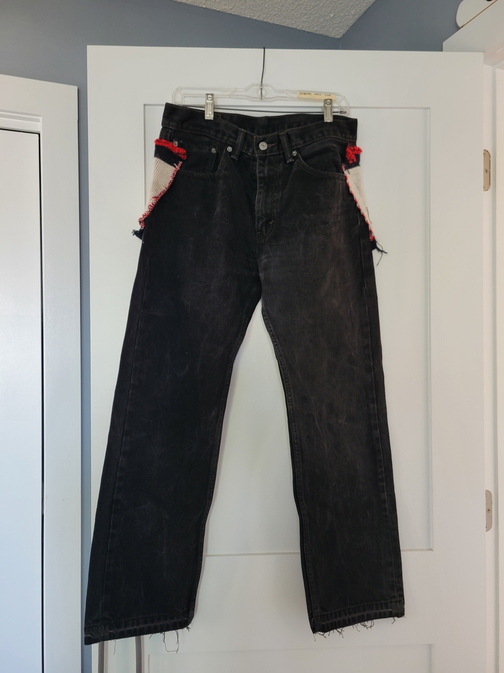 Levi's 505 Black Relaxed Men's Unisex Jeans with NJ DEVILS On Back Side.